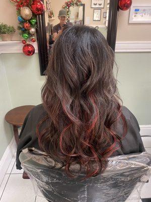 After hair extensions with red highlights