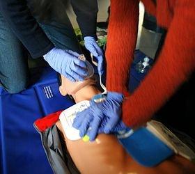 Practicing an Adult CPR method taught in classes on mannequins