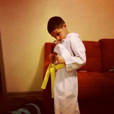 Our son showing off his yellow belt, he was so proud