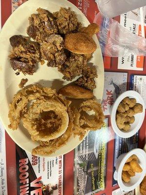 Chicken livers with onion rings, fried okra, and corn nuggets in the back