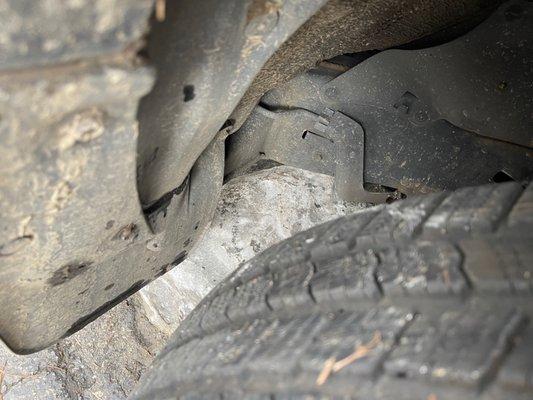 Rock under passenger side of car