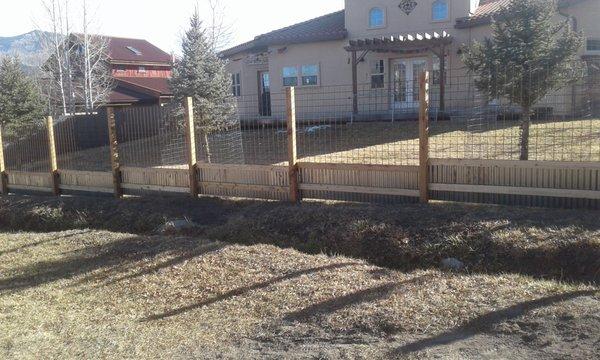 Custom corrugated metal and mesh fence