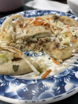 Revuelta pupusa con curtido (bottom) and pupusa de loroco (top)