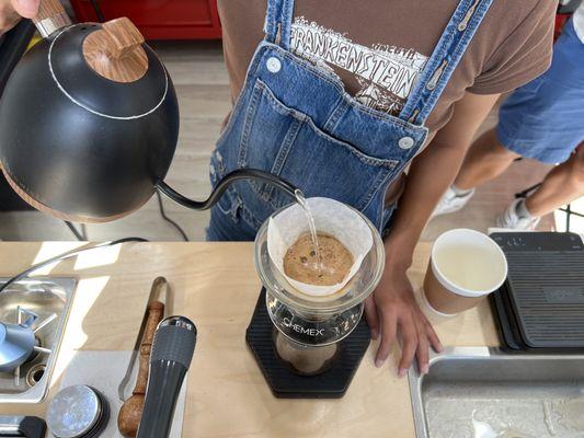 Lisa expertly prepares the perfect pour over cup of Kona SL34 coffee.