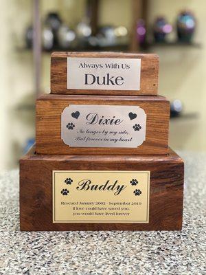 We offer engraved name plates with remembrance quotes for your furry friends urn. Pictured with our popular, Tree of Life, wooden boxed urn.