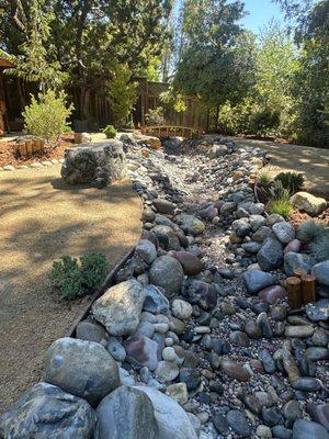 Nice long dry creek mix of different pebbles and a bridge