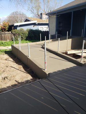 Wheelchair accessible concrete ramp with guard rails