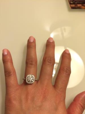 Cushion cut halo with a round center stone