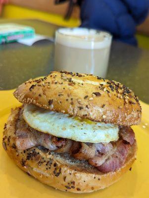 Everything bagel toasted with egg and bacon. The friendly owners behind the counter let me make special order to add bacon.