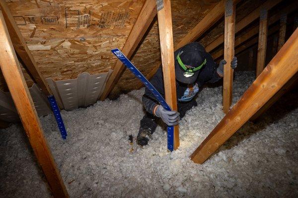 Quality Assurance in Insulation: Our team measures attic insulation levels to provide guaranteed energy efficiency.