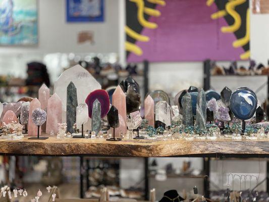 Local artist's artwork, many crystal geodes including rose quartz, smoky quartz, labradorite, amethyst, & more