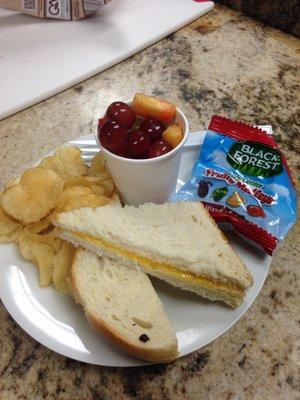 Kids meals feature Grilled Cheese, PB&J or Ham and Cheese alongside applesauce or a fruit cup, chips and a treat!