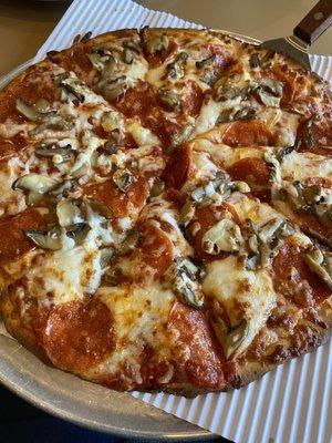 Gluten free pepperoni and mushroom pizza