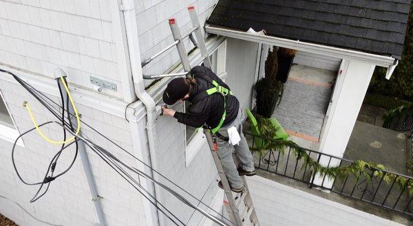 Installing new gutter system on a 2- story home