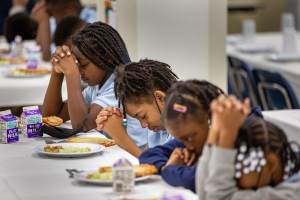 CJA is a faith-based school, and ALL FAITHS are invited.  Here are our girls getting ready to start lunch.