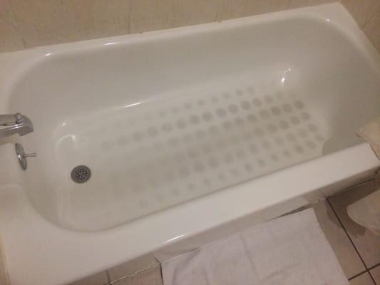 Dirty bath tub they expect people to shower in