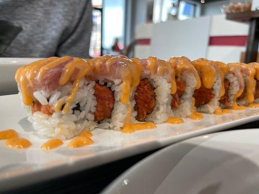 Ichigo roll with spicy tuna inside and yellowtail on top