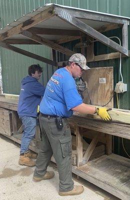 Spencer's and Jay cutting down our 12' 4x4.