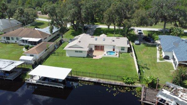 Canal front home with the best looking roof in the neighborhood.