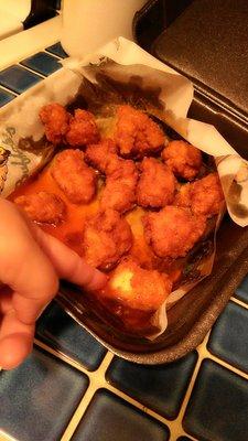 2nd visit for boneless, mild, extra wet wings. Put my finger in to show the amount of oil. 90%oil 10%buffalo sauce. Yuck!