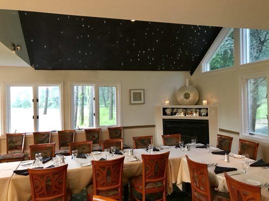 Large party seating inside the restaurant. Sparkling star ceiling.