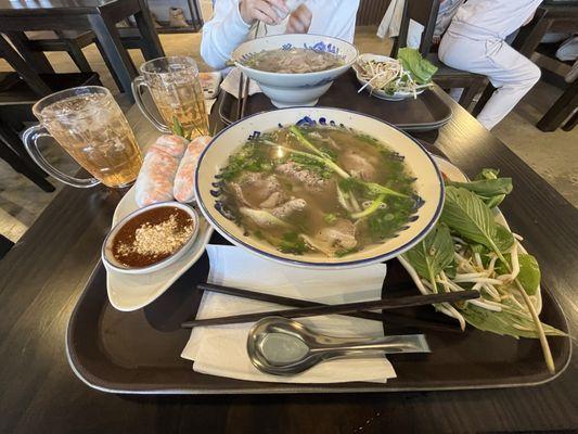 Signature pho, spring rolls and jasmine tea