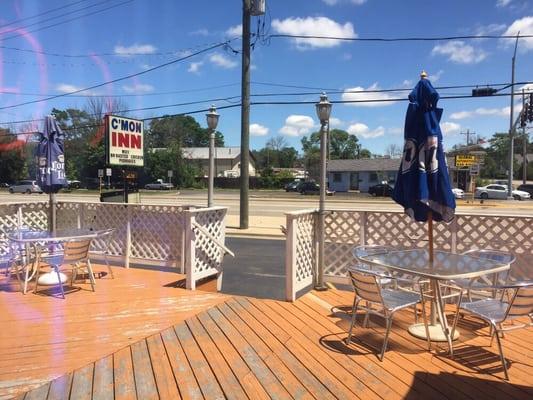 Outdoor patio area with tables and umbrellas