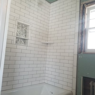 Modern Subway tiles,Niche with accent marble and a shelf