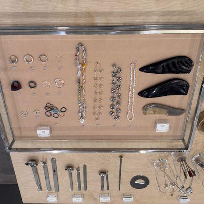 No Gem's curated boutique offers select jewelry and eating utensils