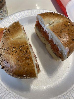 Toasted everything bagel with creamed cheese, lox and tomato