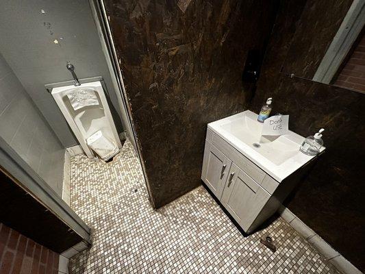 Urinal & SINK out of order in the men's room. I no longer trust touching any surface here.