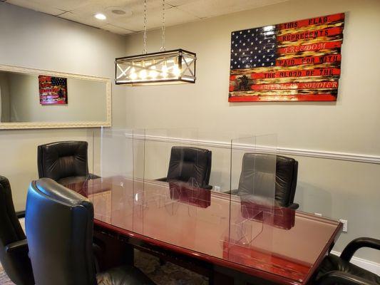 Conference Room at the law office is environmentally protected with safety partitions