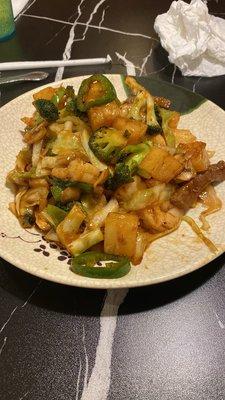 Hibachi with pineapple, broccoli, jalapeños, beef strips, shrimp, and onion with spicy sauce