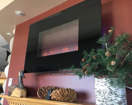 Several burning gas and electric fireplaces to see in our showroom!