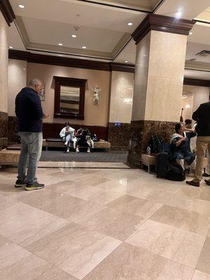 People waiting hours for room that they have paid for.