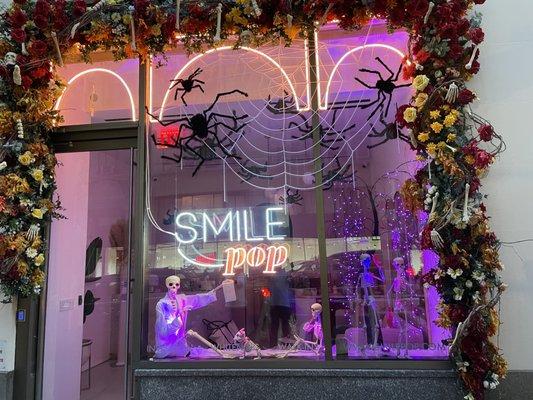 We LOVE decorating for the holidays. Check out Smile Pop's Halloween 2021 window display.