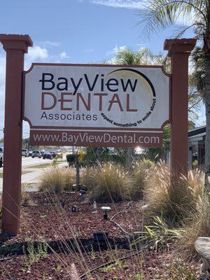 The business sign, visible from the main road.