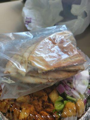 Toasted pita served in a zip top bag.