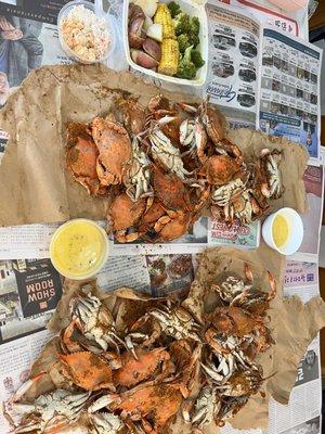 1/2 large crab bushel winnings, 10 extra crabs, Veggie platter, Extra butter garlic sauce, 1/2 regular & Cajun seafood salad