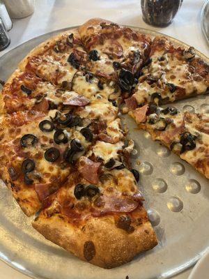 Canadian bacon, mushrooms and black olives. Pepperoni and banana peppers.