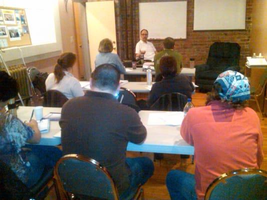 Ray teaching a class of future hypnotherapists