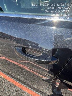 Scratches all over the car damaged door handle