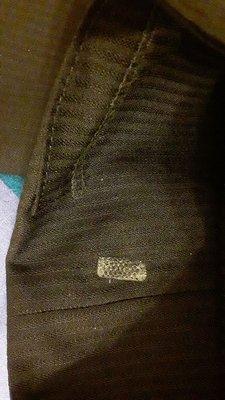 Sticker residue on inside pant leg