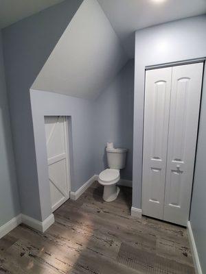 He had to realign the toilet, put up doors and paint.