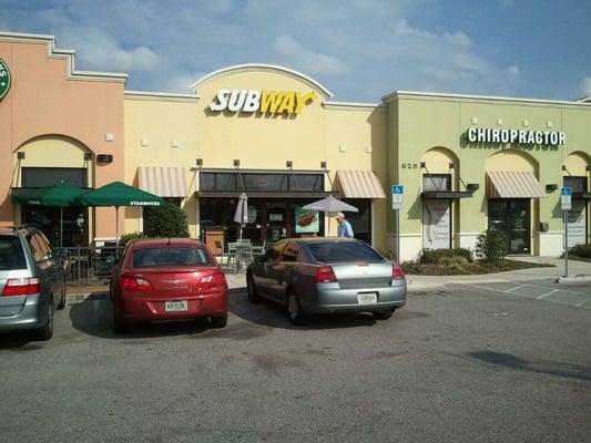 front of restaurant, 3 outdoor tables with umbrellas