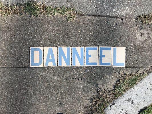 Many of New Orleans' street corners are adorned with iconic white tiles with blue lettering.