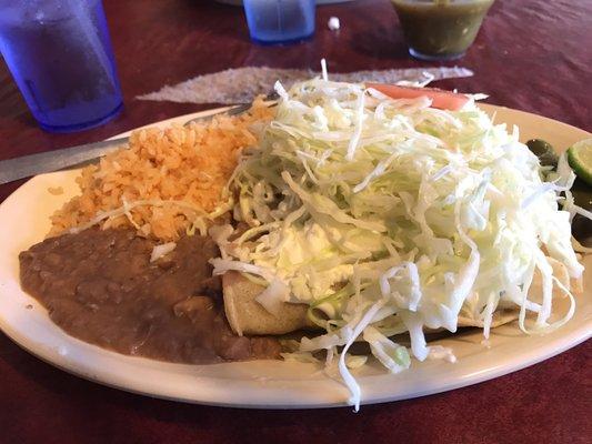 Best dish EVER. Rolled tacos covered in green sauce, cream, cabbage and lime juice.