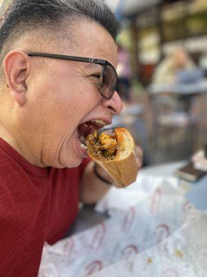 Leon is chowing down on a Heater Philly!