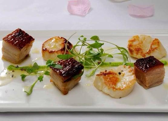 scallops with pork belly white  veggie a truffle vinaigrette