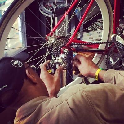 Larry of Larry's Freewheeling working on a Red Basso Road Bike.